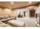 Large basement offering a comfortable seating area and space for a home office at 7586 Chase St, Arvada, CO 80003