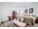 Tranquil bedroom with a textured ceiling and hardwood floors at 7586 Chase St, Arvada, CO 80003