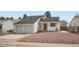 Charming single-Gathering home with a two-car garage, mature trees, and nicely landscaped front yard at 7586 Chase St, Arvada, CO 80003