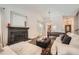 A bright and open living room with a fireplace and hardwood floors, perfect for entertaining guests at 7586 Chase St, Arvada, CO 80003