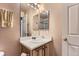 Bathroom featuring a vanity with sink, mirrored cabinet, and walk-in shower at 12835 Mayfair Way # C, Englewood, CO 80112