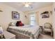 Bright bedroom with a cozy bed, natural light from the window, and decorative accents at 12835 Mayfair Way # C, Englewood, CO 80112