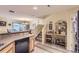 Open-concept kitchen flowing into the dining area with a staircase nearby at 12835 Mayfair Way # C, Englewood, CO 80112