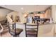 Cozy kitchen featuring bar seating, wood cabinets, and efficient layout at 12835 Mayfair Way # C, Englewood, CO 80112