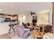 Inviting living room featuring plush seating, a ceiling fan, and an open layout to the kitchen at 12835 Mayfair Way # C, Englewood, CO 80112