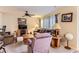 Cozy living room features a ceiling fan, neutral walls, and comfortable seating arrangement at 12835 Mayfair Way # C, Englewood, CO 80112