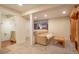 Finished basement featuring neutral carpet, updated lighting, and a comfortable seating area at 6650 Village Rd, Parker, CO 80134