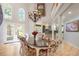 Dining room featuring hardwood floors, large windows, and chandelier at 6650 Village Rd, Parker, CO 80134