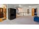 Open loft area featuring a wardrobe, and staircase at 6650 Village Rd, Parker, CO 80134