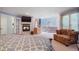 Spacious main bedroom featuring a fire place, sitting area, and en suite bathroom at 6650 Village Rd, Parker, CO 80134