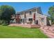 Spacious backyard featuring a large wooden deck with furniture and manicured lawn at 10096 Hughes Pl, Highlands Ranch, CO 80126