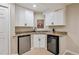 Bar area featuring a beverage cooler, sink, and granite countertops at 10096 Hughes Pl, Highlands Ranch, CO 80126