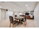 Basement game area featuring a round table and cozy seating area at 10096 Hughes Pl, Highlands Ranch, CO 80126