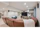 Finished basement featuring a large sectional couch and media center at 10096 Hughes Pl, Highlands Ranch, CO 80126