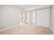 Spacious carpeted basement with white walls and closet space at 10096 Hughes Pl, Highlands Ranch, CO 80126