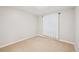 Cozy carpeted bedroom with neutral paint and a white curtain at 10096 Hughes Pl, Highlands Ranch, CO 80126