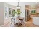 Bright breakfast nook with large windows and a view of the outdoor deck at 10096 Hughes Pl, Highlands Ranch, CO 80126