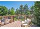 Inviting deck with outdoor seating and a view of the yard, perfect for relaxation and enjoying the weather at 10096 Hughes Pl, Highlands Ranch, CO 80126
