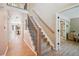 Inviting entryway with hardwood floors and a staircase leading to the second floor at 10096 Hughes Pl, Highlands Ranch, CO 80126