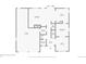 First floor plan featuring living room, kitchen, bathroom, garage, laundry, and office at 10096 Hughes Pl, Highlands Ranch, CO 80126