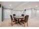 Game room features a round table with leather chairs and storage at 10096 Hughes Pl, Highlands Ranch, CO 80126