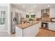 Modern kitchen with stainless steel appliances, granite countertops, and a center island at 10096 Hughes Pl, Highlands Ranch, CO 80126