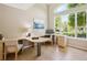 Bright and airy office space with large windows and built-in desk at 10096 Hughes Pl, Highlands Ranch, CO 80126