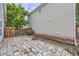 Backyard with stone pavers, plants, and wood fence at 20000 E Mitchell Pl # 35, Denver, CO 80249