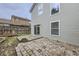 Backyard featuring stone pavers, sliding glass door, and vinyl siding at 20000 E Mitchell Pl # 35, Denver, CO 80249
