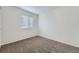 Bedroom showcasing neutral carpet and a bright window at 20000 E Mitchell Pl # 35, Denver, CO 80249
