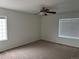 Bedroom with neutral colored carpet and two large windows with blinds at 20000 E Mitchell Pl # 35, Denver, CO 80249