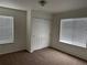 Bedroom includes a closet with sliding doors, carpet and windows at 20000 E Mitchell Pl # 35, Denver, CO 80249