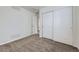 This carpeted bedroom offers closet space and neutral paint at 20000 E Mitchell Pl # 35, Denver, CO 80249