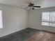 Bedroom features a ceiling fan, windows for natural light, carpeted flooring, and neutral color palette at 20000 E Mitchell Pl # 35, Denver, CO 80249