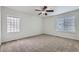 Bedroom showcasing neutral carpet, a ceiling fan, and a bright window at 20000 E Mitchell Pl # 35, Denver, CO 80249