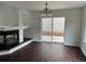 Dining room with sliding glass doors, wood floors, and a fireplace at 20000 E Mitchell Pl # 35, Denver, CO 80249