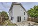 Exterior view of two-story home with vinyl siding and stone paver patio at 20000 E Mitchell Pl # 35, Denver, CO 80249