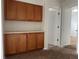 Hallway features built-in cabinets with countertops for storage, and access to other rooms of the house at 20000 E Mitchell Pl # 35, Denver, CO 80249