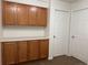 Hallway features cabinets for storage, a countertop, and two doors at 20000 E Mitchell Pl # 35, Denver, CO 80249