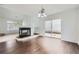 Bright living room showcasing wood floors, a fireplace, and sliding glass doors leading to a patio at 20000 E Mitchell Pl # 35, Denver, CO 80249