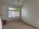 Bright living room features a large window, ceiling fan, and neutral carpet at 20000 E Mitchell Pl # 35, Denver, CO 80249