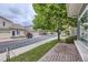 Street view of a neighborhood featuring well-maintained homes with manicured lawns and mature trees at 20000 E Mitchell Pl # 35, Denver, CO 80249