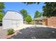 Large backyard with a shed and covered patio, offering ample space for outdoor activities at 209 S 13Th Ave, Brighton, CO 80601