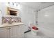 Cozy bathroom features a single vanity, tiled backsplash, and shower-tub combo at 209 S 13Th Ave, Brighton, CO 80601