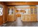 Bright dining room with built in cabinets and views of the kitchen at 209 S 13Th Ave, Brighton, CO 80601