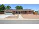 Charming single-story brick house with a well-maintained front yard, driveway, and attached garage at 209 S 13Th Ave, Brighton, CO 80601