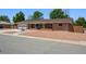 Charming single-story brick house with a well-maintained front yard, driveway, and attached garage at 209 S 13Th Ave, Brighton, CO 80601