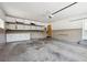 Spacious garage features built-in shelving and storage cabinets for organization at 209 S 13Th Ave, Brighton, CO 80601