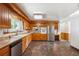 Updated kitchen with stainless steel appliances, tile backsplash, and ample counter space at 209 S 13Th Ave, Brighton, CO 80601