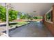 Covered patio with ample space for outdoor seating and views of the backyard at 209 S 13Th Ave, Brighton, CO 80601